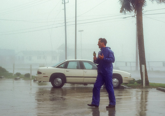 TV Reporter Broadcasting During a Hurricane