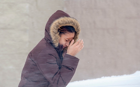 Woman Walking in Wind-Blown Snow (Horizontal)