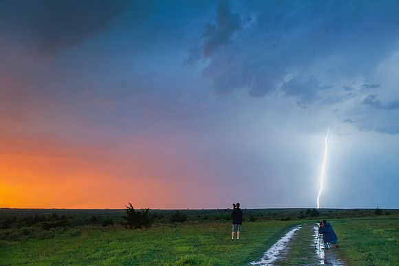 Storm Chasers Shooting Lightning