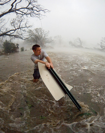 Man Clutching Sign During Hurricane Katrina