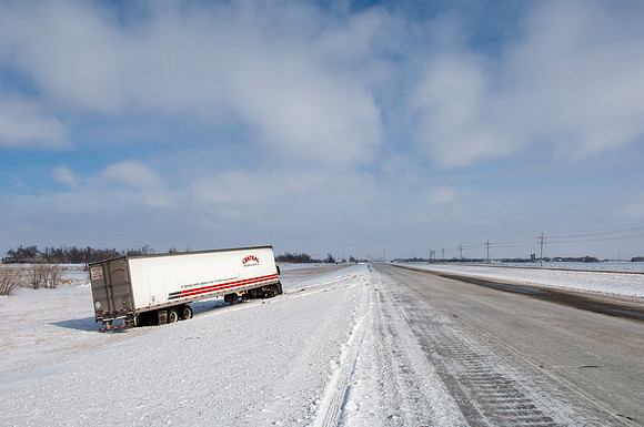 Semi-Truck Stuck in Snow Off Highway