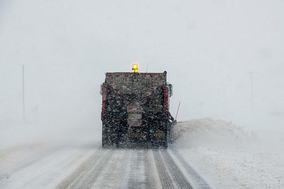 Snow Plow in Action (Seen From Behind)