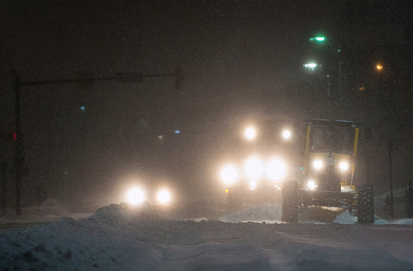 Construction Equipment Plowing Snow at Night