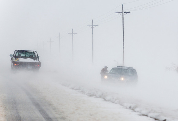 Good Samaritan Helping Motorist Stuck in Blizzard