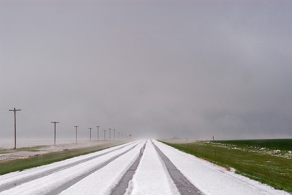 Road Covered With Hailstones (With Tire Tracks)