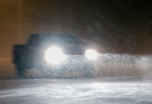 Pickup Truck Driving in Snow Storm at Night