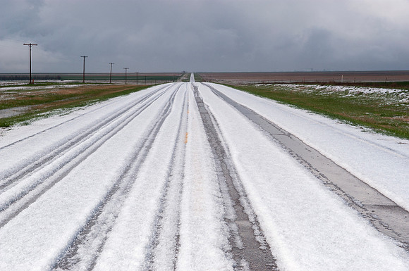 Road Covered With Hailstones (With Tire Tracks)