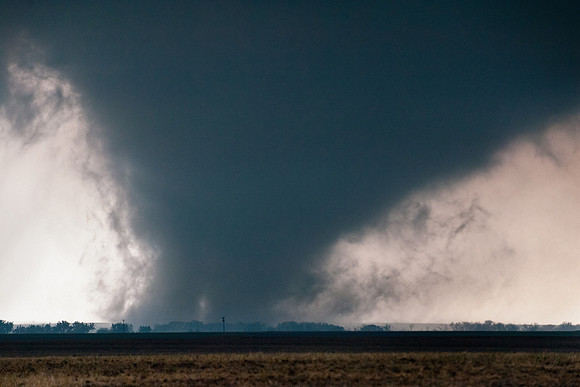 Large Tornado Moving Over Rural Landscape
