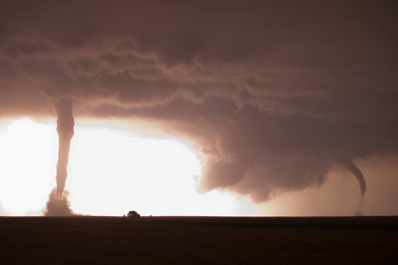 Twin Night Tornadoes Illuminated by Lightning