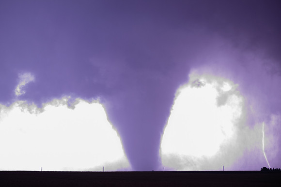 Large Tornado Illuminated by Lightning